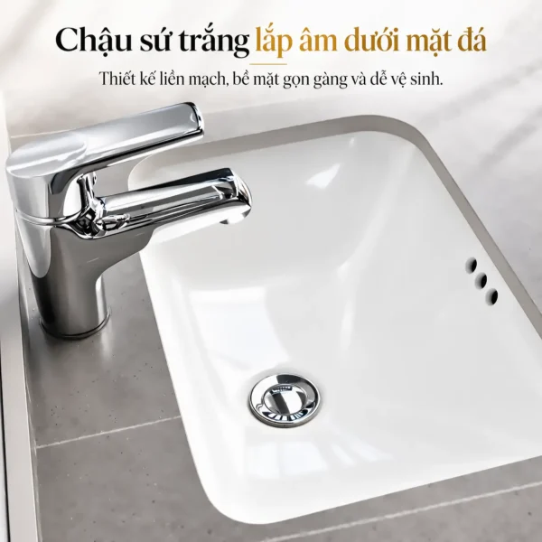 Chậu sứ trắng lắp âm dưới mặt đá của tủ lavabo nhôm Eurolife BLV-AL15, lòng chậu bo cong kết hợp vòi nước minh họa.